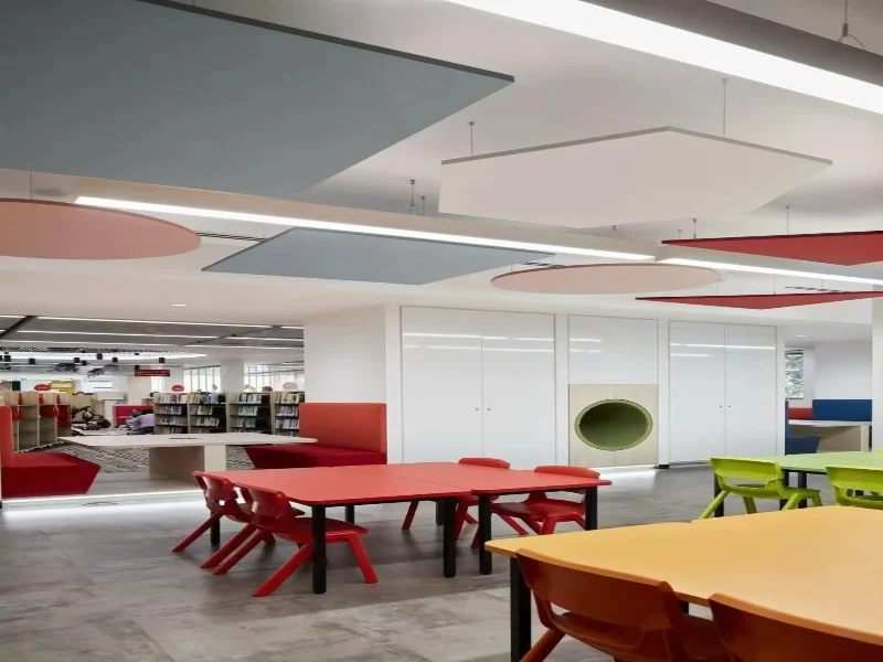 Decorative ceiling baffles for echo reduction in large interior spaces