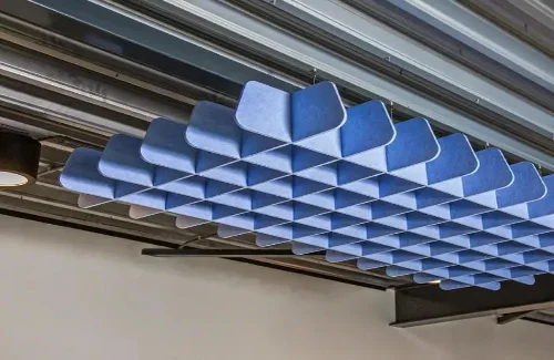 Customized ceiling systems for enhanced sound control and modern architectural design.